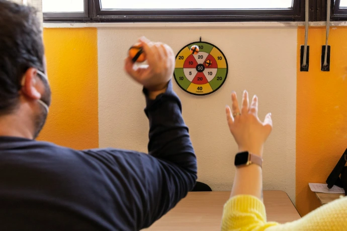 a man drawing on a white board